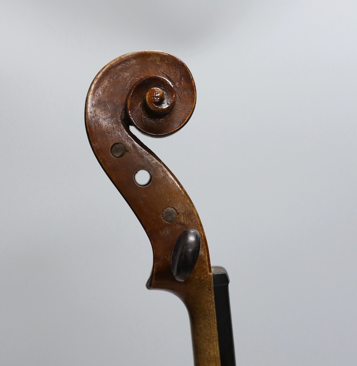 A cased three quarter size violin, labelled E.Coiffier, 56cms long